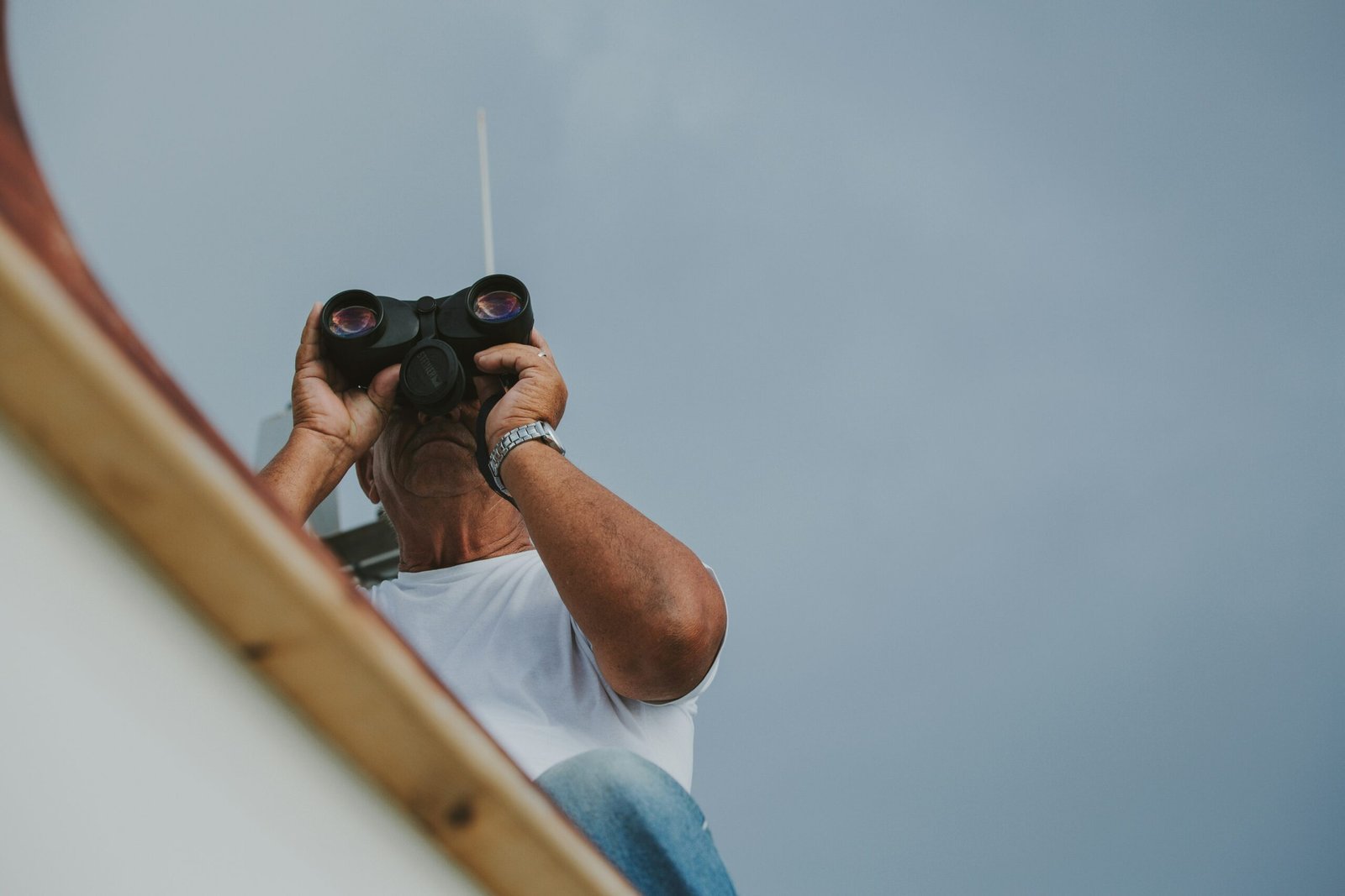 Diverse film crew working on location near a tropical beach