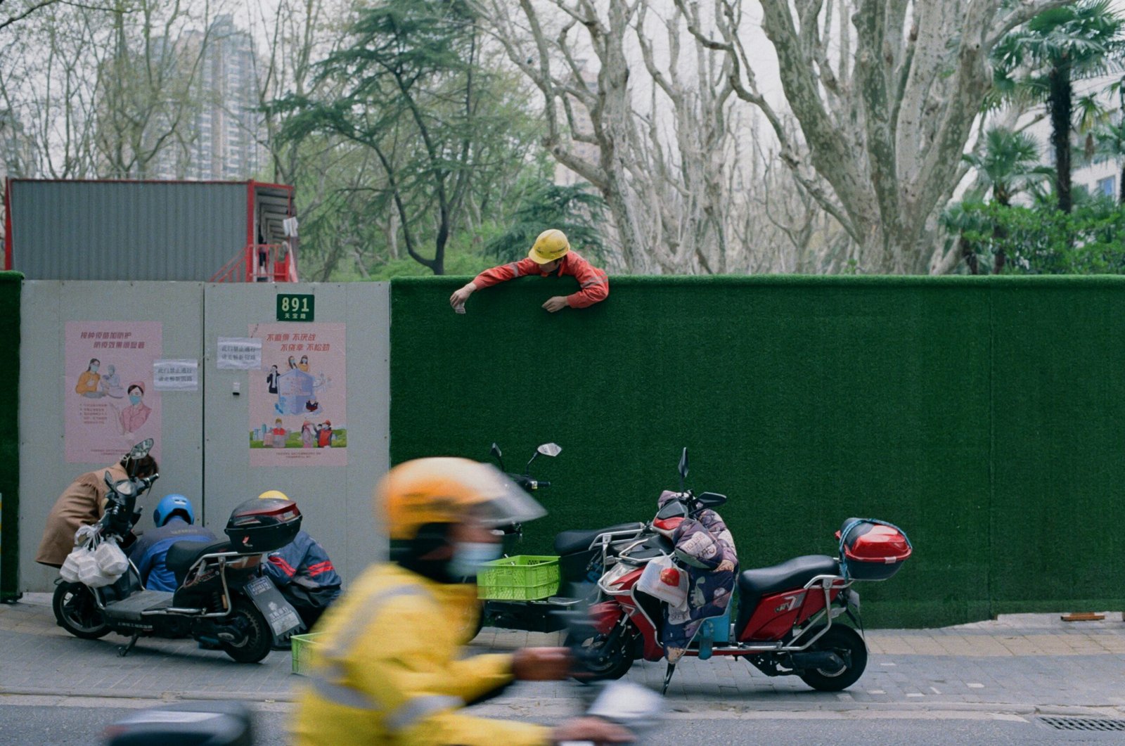 Stunt actors performing a dangerous jump during filming.