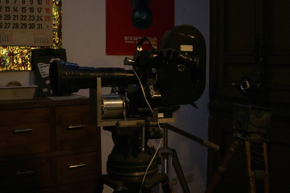 Producer signing film production insurance forms at a desk