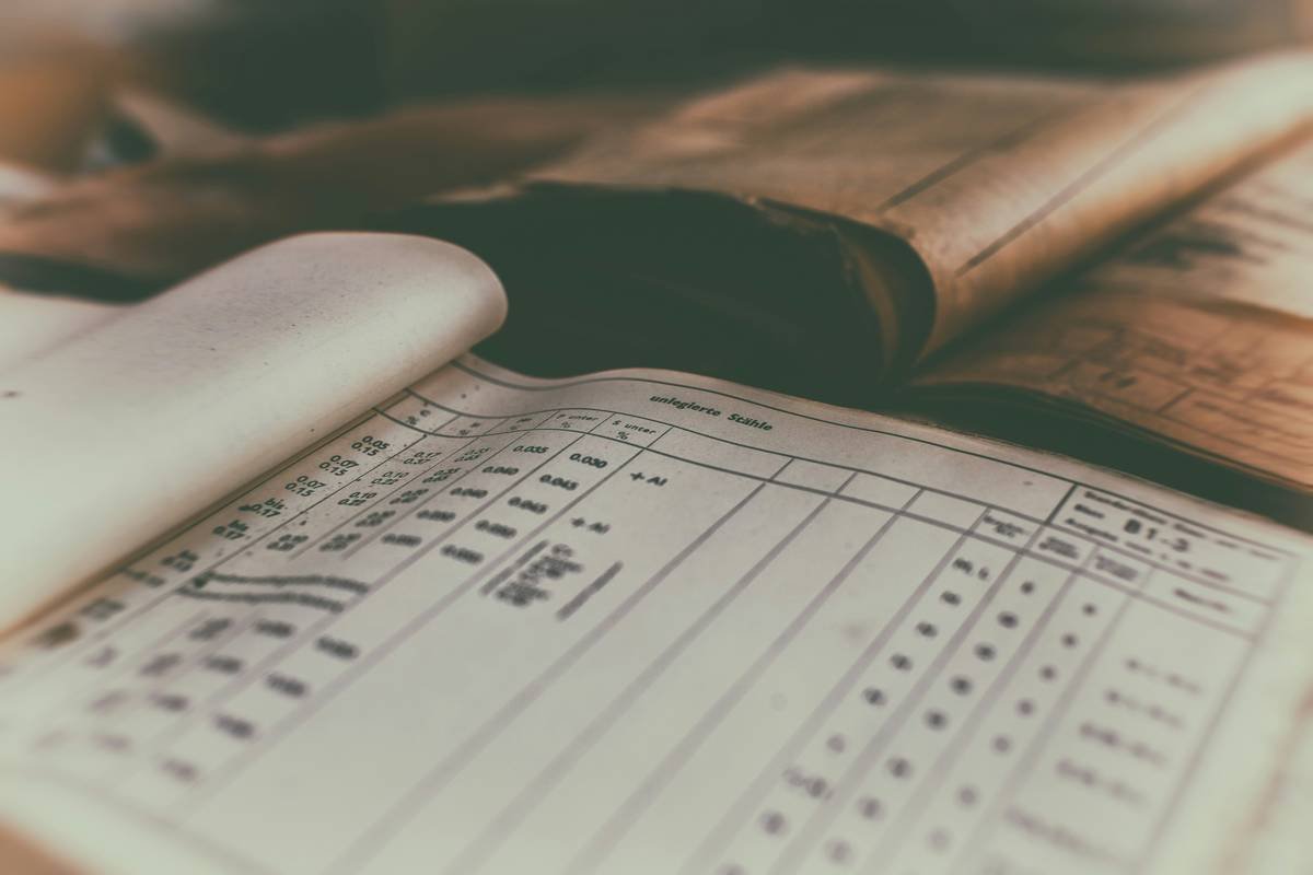 Film crew setting up camera equipment on a tripod